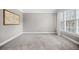 Cozy office space features a neutral palette, plush carpeting, ample natural light, and an accent wall at 940 Magnolia Blossom Ct, Alpharetta, GA 30005
