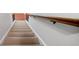Carpeted staircase with wooden handrail at 940 Magnolia Blossom Ct, Alpharetta, GA 30005