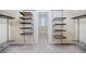 Organized walk-in closet with custom shelving and hanging space at 940 Magnolia Blossom Ct, Alpharetta, GA 30005