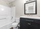 Clean bathroom with white vanity, and a shower-tub combo at 1730 Stanwood Nw Dr, Kennesaw, GA 30152