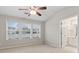 Spacious bedroom with three windows and an attached bathroom at 1730 Stanwood Nw Dr, Kennesaw, GA 30152