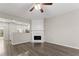 Open-concept living room with a fireplace and wood flooring at 1730 Stanwood Nw Dr, Kennesaw, GA 30152