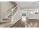 Open-concept living room with hardwood floors and stairs to the upper level at 1730 Stanwood Nw Dr, Kennesaw, GA 30152