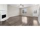 Bright living room with a fireplace and hardwood floors at 1730 Stanwood Nw Dr, Kennesaw, GA 30152