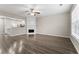 Open-concept living room with a fireplace and wood flooring at 1730 Stanwood Nw Dr, Kennesaw, GA 30152