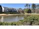 Beautiful view of the community pond surrounded by well-maintained greenery at 1730 Stanwood Nw Dr, Kennesaw, GA 30152