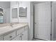 The bathroom features a mirror, vanity, sink, and a three door storage closet at 4333 Dunwoody Park # 1211, Atlanta, GA 30338