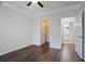 This bedroom features hardwood floors, a ceiling fan and an open bathroom at 4333 Dunwoody Park # 1211, Atlanta, GA 30338