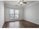 Well-lit bedroom boasts hardwood floors and a window offering natural light at 4333 Dunwoody Park # 1211, Atlanta, GA 30338
