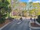 Community entrance with gated entry, set within a lush, green landscape at 4333 Dunwoody Park # 1211, Atlanta, GA 30338
