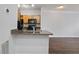 Stylish kitchen with granite countertops, wood cabinets, black appliances, and hardwood floors at 4333 Dunwoody Park # 1211, Atlanta, GA 30338