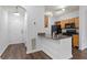 View of the kitchen with granite countertops and stainless steel sink next to the entry door at 4333 Dunwoody Park # 1211, Atlanta, GA 30338