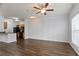Bright living room featuring hardwood floors, a ceiling fan, and neutral wall colors at 4333 Dunwoody Park # 1211, Atlanta, GA 30338