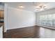 Bright living room featuring hardwood floors, crown molding, and a ceiling fan at 4333 Dunwoody Park # 1211, Atlanta, GA 30338