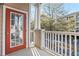 Relaxing patio with white railings overlooking a parking lot and mature trees at 4333 Dunwoody Park # 1211, Atlanta, GA 30338