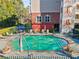 Community swimming pool and lounge chairs amidst landscaped grounds at 4333 Dunwoody Park # 1211, Atlanta, GA 30338