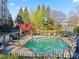 Community swimming pool and lounge chairs amidst landscaped grounds at 4333 Dunwoody Park # 1211, Atlanta, GA 30338