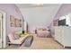 Comfortable bedroom with vaulted ceiling, sofa, bed and dresser at 735 Ambur Cove Way Nw, Lawrenceville, GA 30043