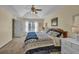 Inviting bedroom with natural light, soft carpet, and furniture to create a cozy, tranquil retreat at 735 Ambur Cove Way Nw, Lawrenceville, GA 30043