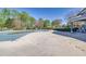 Community pool covered for the off season in a fenced recreational area at 735 Ambur Cove Way Nw, Lawrenceville, GA 30043