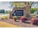 Stone sign for Ambur Cove community surrounded by landscaping at 735 Ambur Cove Way Nw, Lawrenceville, GA 30043