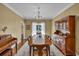 Formal dining area with hardwood floors, ample seating, and elegant decor at 735 Ambur Cove Way Nw, Lawrenceville, GA 30043