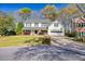 Inviting two-story home featuring a well-manicured lawn and attached garage at 735 Ambur Cove Way Nw, Lawrenceville, GA 30043
