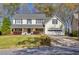 Inviting two-story home featuring a well-manicured lawn and attached garage at 735 Ambur Cove Way Nw, Lawrenceville, GA 30043