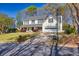 Inviting two-story home featuring a well-manicured lawn and attached garage at 735 Ambur Cove Way Nw, Lawrenceville, GA 30043