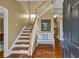 Inviting foyer boasts gleaming hardwood floors, elegant staircase, and stylish decor at 735 Ambur Cove Way Nw, Lawrenceville, GA 30043