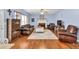 Cozy living room boasts a fireplace, hardwood floors, and ample seating at 735 Ambur Cove Way Nw, Lawrenceville, GA 30043