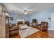 Cozy living room boasts a fireplace, hardwood floors, and ample seating at 735 Ambur Cove Way Nw, Lawrenceville, GA 30043