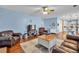 Open living room adjacent to the kitchen is filled with natural light at 735 Ambur Cove Way Nw, Lawrenceville, GA 30043
