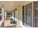 Charming porch with decorative plants, updated lighting, and a glimpse of the neighborhood at 735 Ambur Cove Way Nw, Lawrenceville, GA 30043