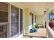 Charming porch with decorative plants, updated lighting, and a glimpse of the neighborhood at 735 Ambur Cove Way Nw, Lawrenceville, GA 30043