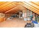 Spacious attic featuring plywood flooring, open wood beams, and potential for storage or finishing at 103 New Hood Rd, Stockbridge, GA 30281