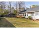 A spacious backyard with lush green grass, a wooden deck, and a sturdy fence, offering ample outdoor space at 103 New Hood Rd, Stockbridge, GA 30281