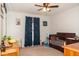 Bedroom showcasing a classic wooden crib, complemented by blue curtains and playful decor at 103 New Hood Rd, Stockbridge, GA 30281