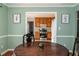 Open concept dining room with kitchen view, great for seamless entertaining at 103 New Hood Rd, Stockbridge, GA 30281