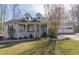 Charming single-Gathering home with a welcoming front porch and attached two-car garage at 103 New Hood Rd, Stockbridge, GA 30281
