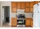 Efficient kitchen featuring wooden cabinets, stainless steel appliances, and natural light at 103 New Hood Rd, Stockbridge, GA 30281