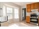Traditional kitchen with wooden cabinets, stainless steel appliances, and a bay window for natural light at 103 New Hood Rd, Stockbridge, GA 30281