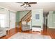Bright living room with hardwood floors, staircase, and neutral-toned walls at 103 New Hood Rd, Stockbridge, GA 30281
