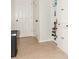 Mud Room complete with a storage cabinet for organizing shoes and accessories, near to the garage door at 103 New Hood Rd, Stockbridge, GA 30281