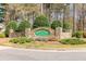 Community entrance sign surrounded by manicured landscaping at 103 New Hood Rd, Stockbridge, GA 30281