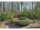 The large backyard patio offers a quiet seating area in a natural setting at 3141 Branford Ct, Marietta, GA 30062