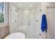Modern bathroom boasts walk-in shower with glass doors, marble-look tile, and dual shower heads at 3141 Branford Ct, Marietta, GA 30062