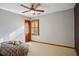 Bedroom featuring neutral walls, carpet floors, a ceiling fan and a wood-framed window at 3141 Branford Ct, Marietta, GA 30062
