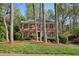 Charming two-story brick home with mature trees, a lush lawn, and classic curb appeal at 3141 Branford Ct, Marietta, GA 30062