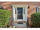 Elegant front entrance with classic black door, sidelights, and decorative sconces at 3141 Branford Ct, Marietta, GA 30062
